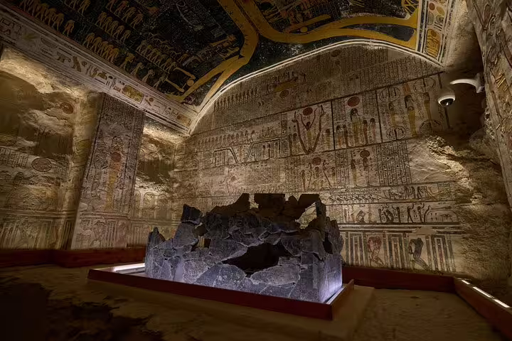 Ancient tomb chamber in Luxor West Bank with vivid hieroglyphs and carved walls, Valley of the Kings tour stop