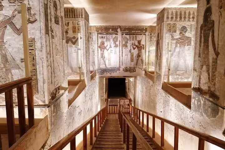 Intricately decorated tomb corridor with vivid hieroglyphs and ancient Egyptian art in Luxor's West Bank.