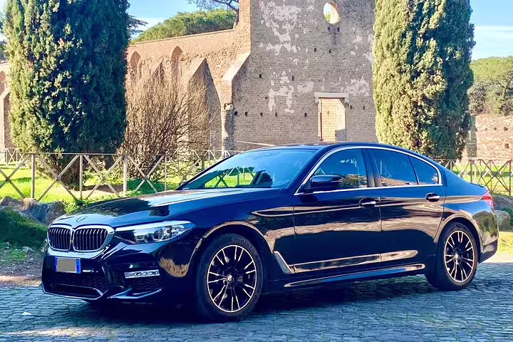 Luxury black BMW sedan for private transfer from Berlin Airport BER to Berlin city center in style