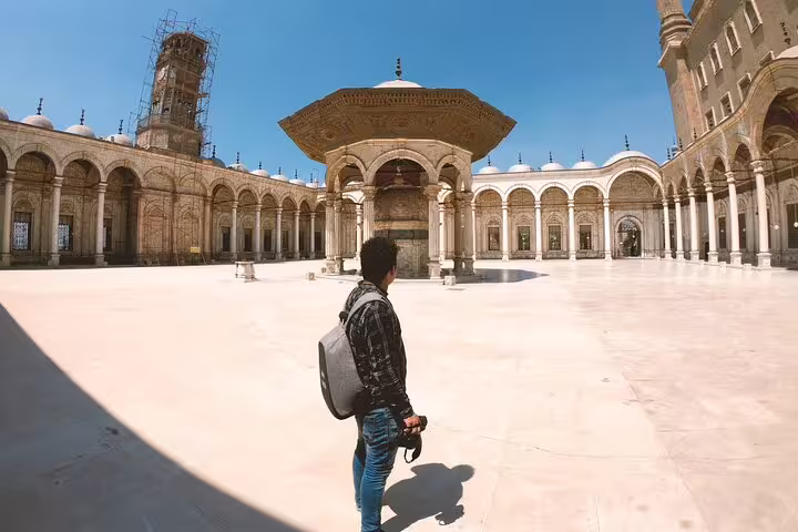 Traveler in Mosque of Muhammad Ali courtyard, Cairo luxury travel from Four Seasons Hotel with guide