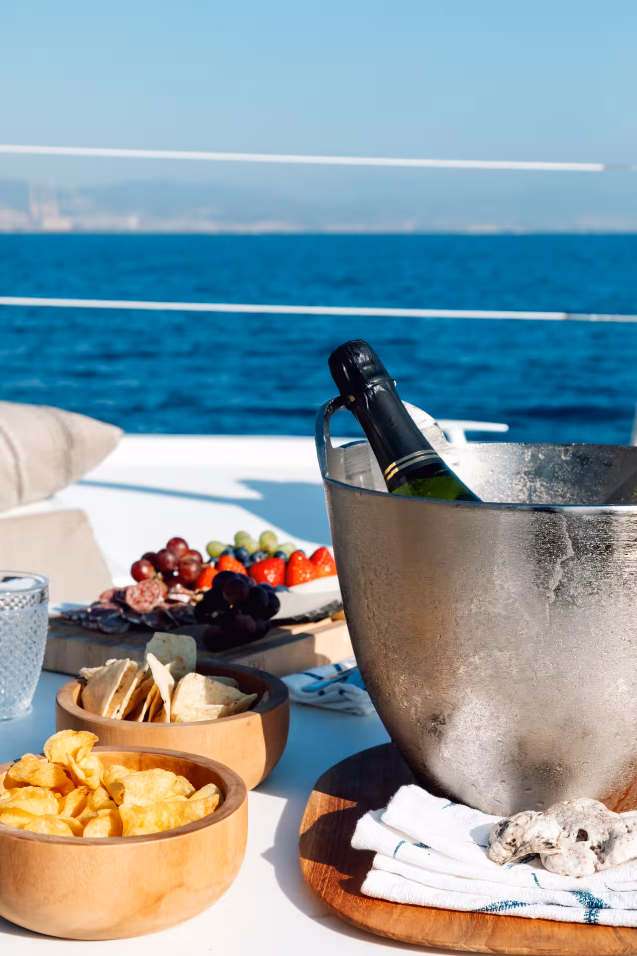 Champagne on ice with tapas and fruit on Bali 4.2 luxury catamaran, private 4-hour Barcelona cruise