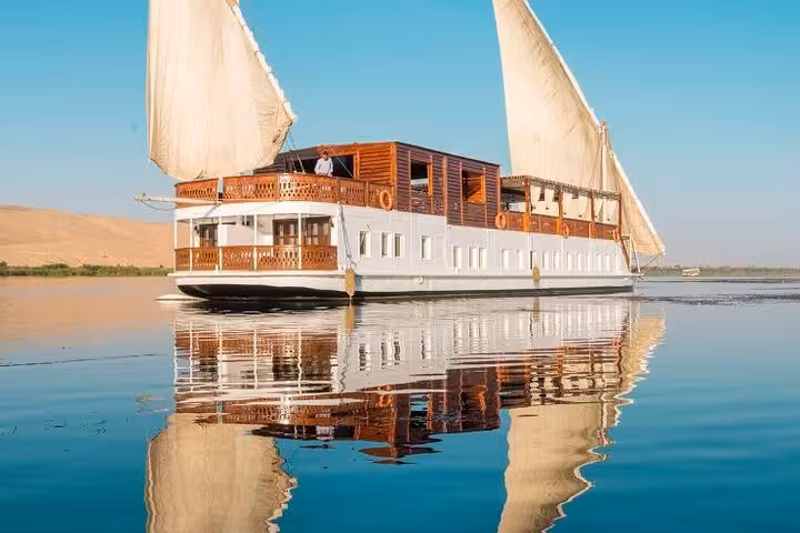 Luxury Dahabiya sailboat cruising the Nile at sunrise, 5 days 4 nights Egypt Nile cruise from Luxor to Aswan