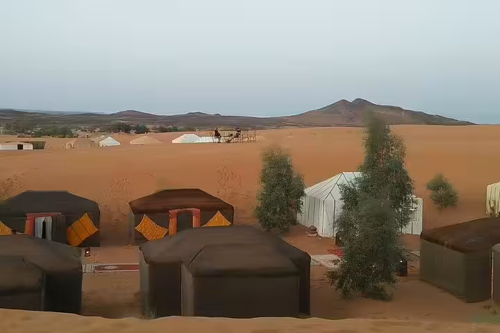 Luxury desert camp tents in Merzouga dunes on 3-day private Marrakech to Fes Sahara tour Morocco