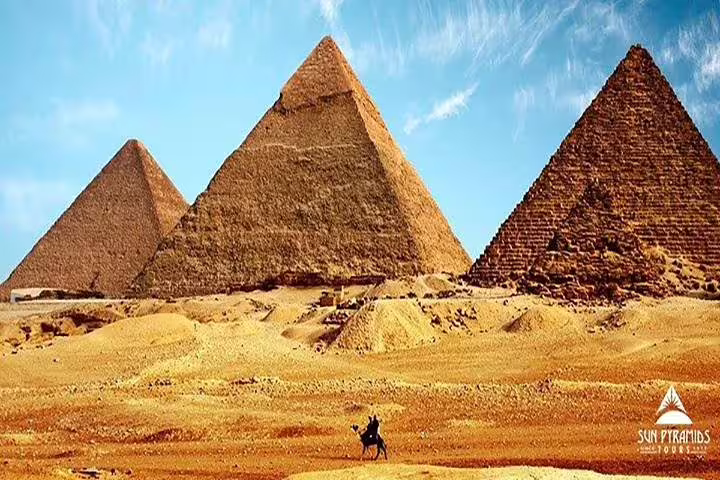 Great Pyramids of Giza under blue sky, iconic Cairo sightseeing on luxury 8-day Egypt tour package