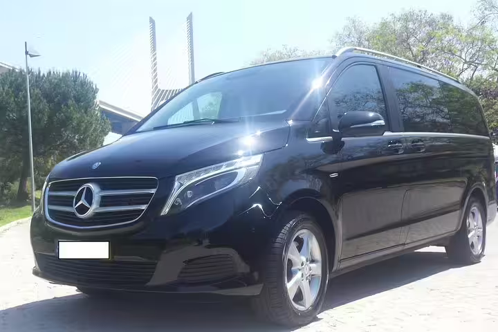 Luxurious black Mercedes van for private transfer from Lisbon to Algarve, offering comfort and convenience for travelers.