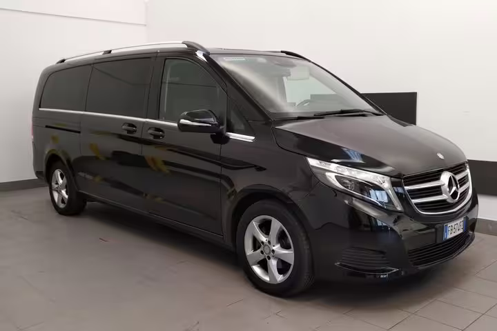 Luxurious black Mercedes van for private scenic transfer from Venice to Milano, offering comfort and style.