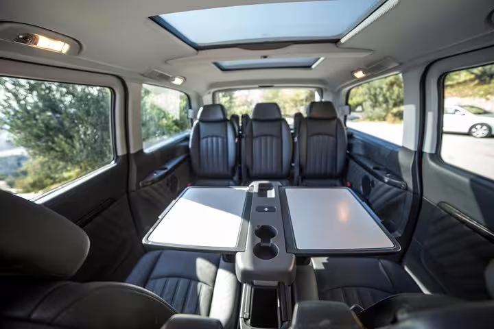 Luxury private minivan interior with leather seats and tables for a Best of Athens half-day private tour