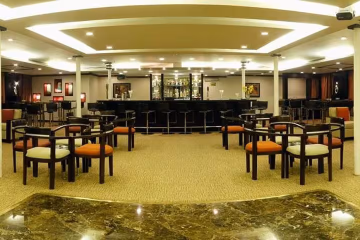 Elegant 5-star Nile cruise lounge bar interior, luxury seating for 5-day private Luxor to Aswan tour