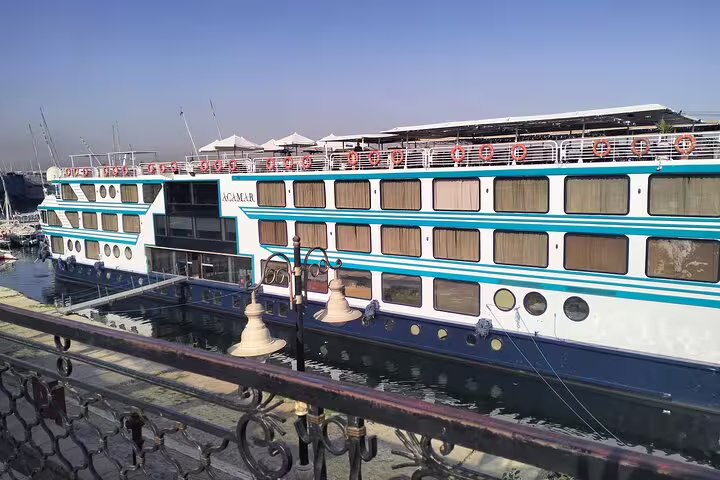 Luxury Nile cruise ship docked in Cairo, Egypt, part of 8-day Cairo pyramids and river cruise tour