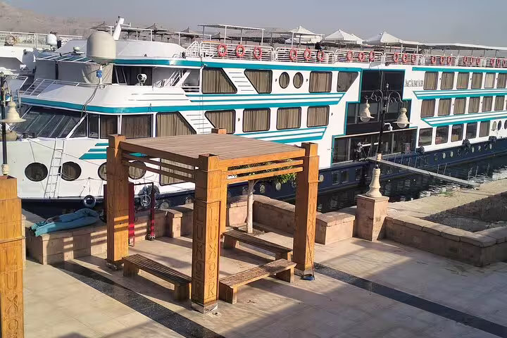 Luxury Nile cruise ship docked in Egypt, part of 7-day Cairo pyramids and Nile cruise tour with flights