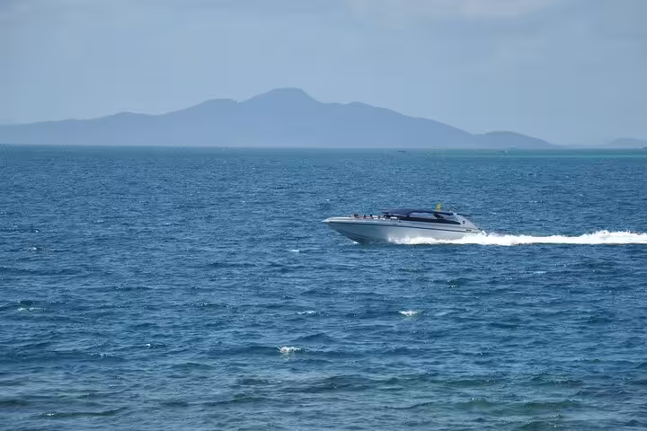 Luxury private speedboat cruising the Red Sea from Sharm El Sheikh, 2-hour charter with hotel pickup