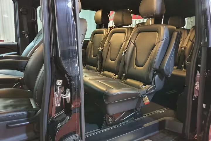 Luxury private van interior for Madrid hotel pickup and transfer to Atocha Station with spacious leather seats