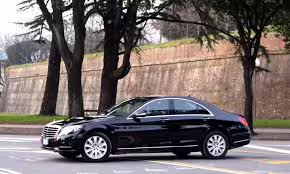 Luxury black sedan for private direct transfer service between Naples and Capri, offering comfortable door-to-door travel