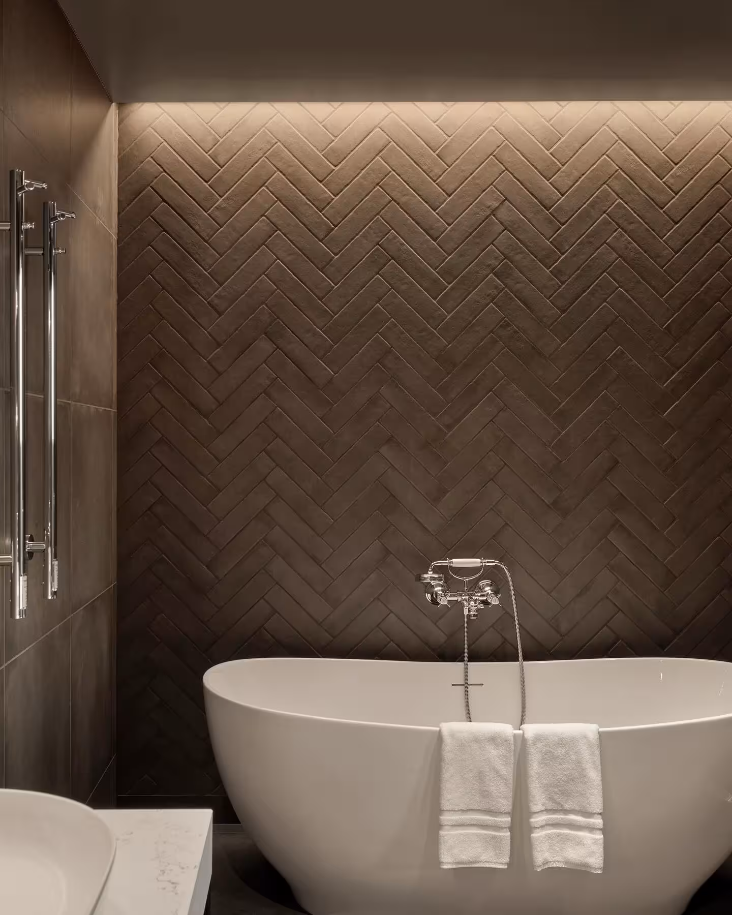 Elegant freestanding soaking bathtub in a luxury Iceland hotel room, perfect for a romantic Blue Lagoon proposal getaway.