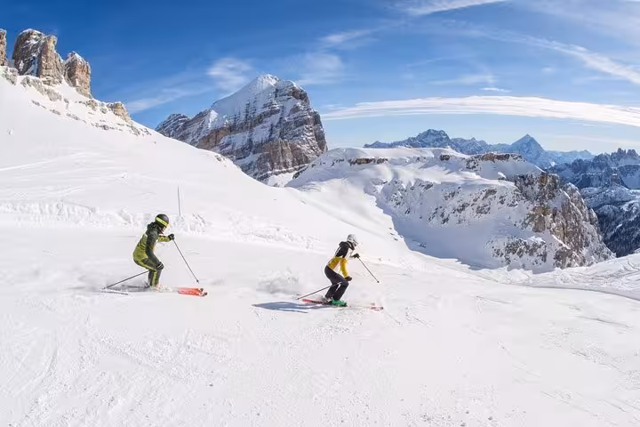 Luxury van traveling from snow-covered Cortina d'Ampezzo to Venice, highlighting scenic winter transfer service.