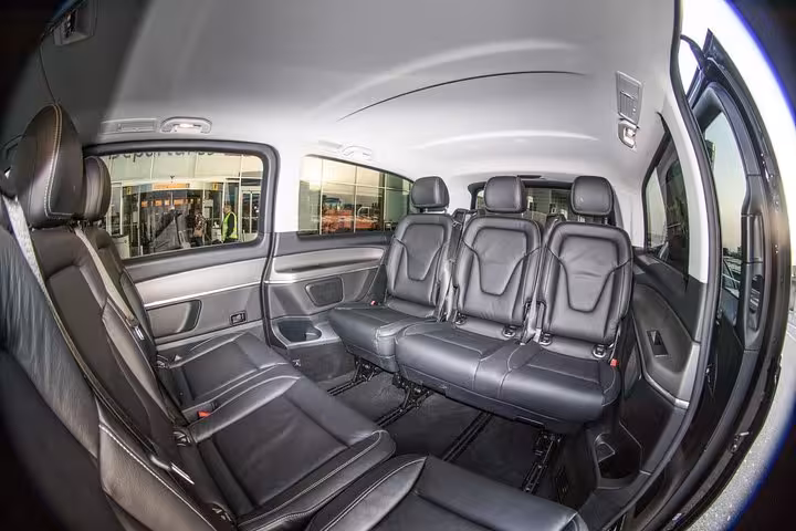 Spacious luxury van interior with leather seats for Amsterdam private local transfer, airport or hotel ride
