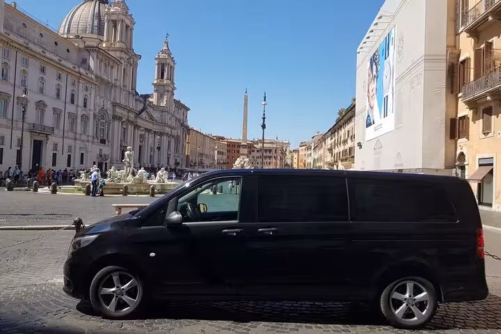 Luxury van in front of Rome's Piazza Navona, ideal for private day trips from Civitavecchia port.