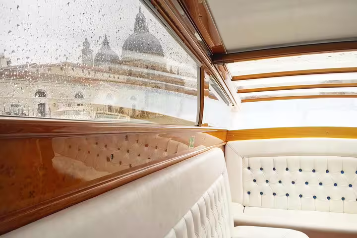 Luxury private Venice water taxi interior on Grand Canal tour to Murano and Burano with local lunch stop
