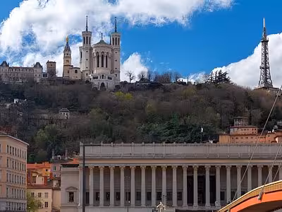 Basilica of Fourvière atop Fourvière Hill overlooking Lyon's historic Palais de Justice and old town