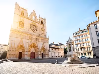 Lyon Cathedral Saint-Jean facade with Gothic arches and cobblestone plaza in historic Old Lyon district