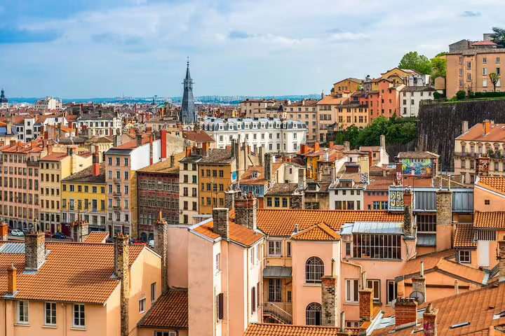 Aerial view of Lyon Croix-Rousse neighborhood with terracotta rooftops and colorful historic buildings