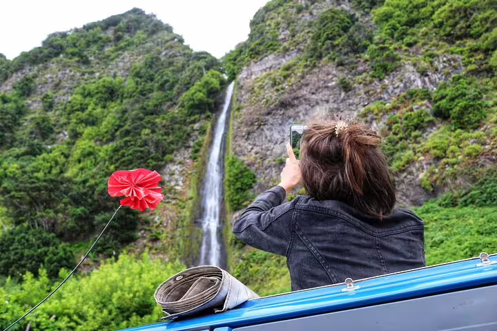 Traveler captures stunning waterfall on a 4x4 tour through Madeira's lush northwest frontiers, highlighting adventure and nature.