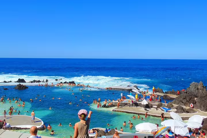 Crowded natural lava pools in Madeira Island offer a refreshing swim with stunning ocean views, ideal for quick getaways.
