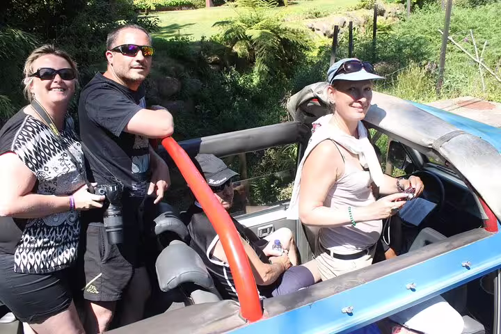 Tourists enjoying a thrilling open-top jeep adventure through Madeira's lush Enchanted Terraces and Fanal UNESCO sites.