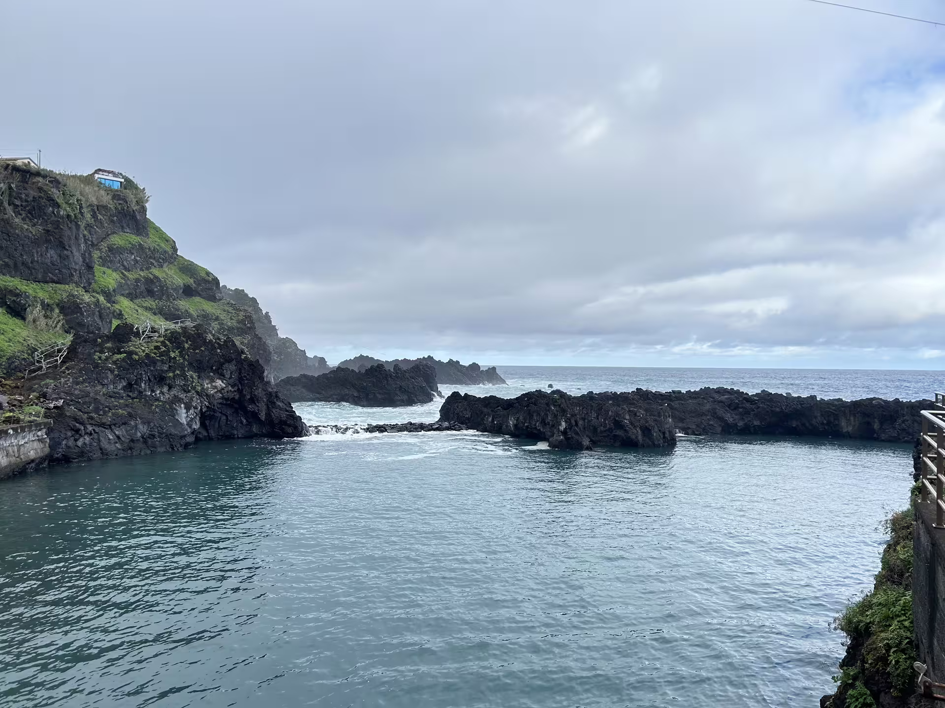 Scenic coastal view of Madeira's rugged cliffs and tranquil ocean, perfect for a private tour exploring the island in comfort.