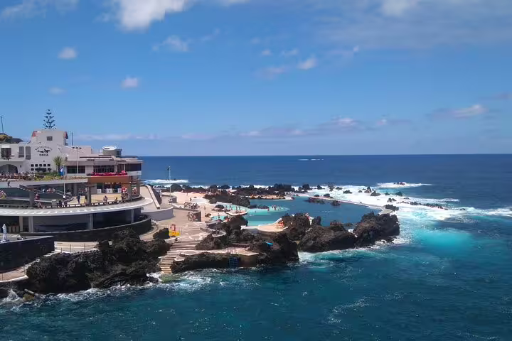 Stunning coastal view of Madeira's natural pools and rocky landscape, perfect for a west island safari adventure.