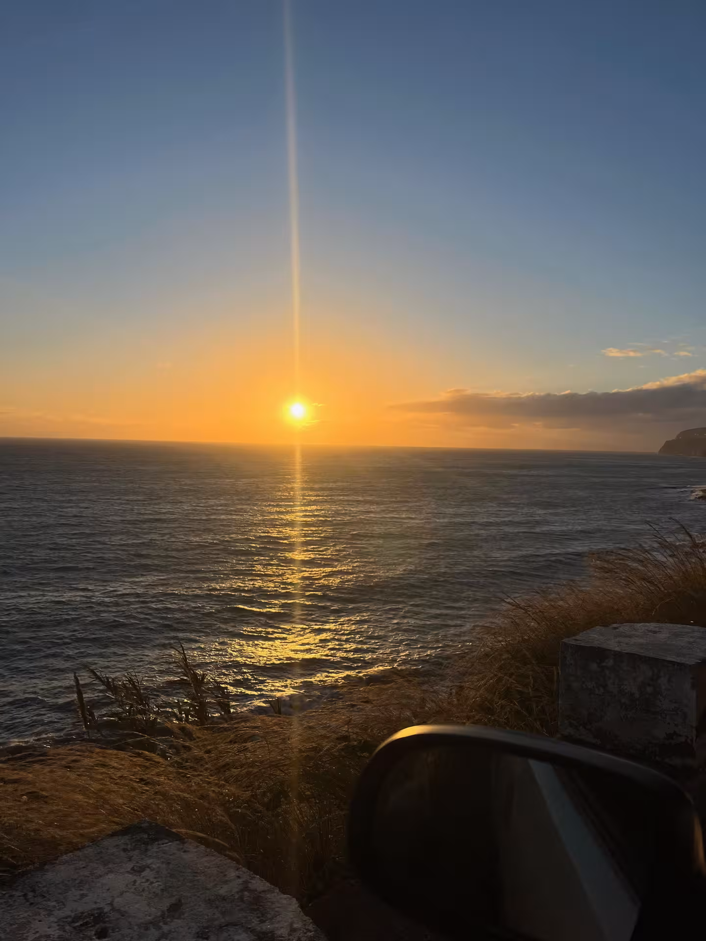 Golden sunset over the Atlantic from a cliffside stop on the 4x4 Experience North Wonders São Miguel tour