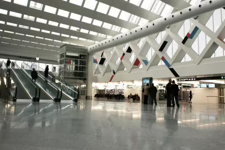 Modern Madrid Barajas Airport terminal interior, ideal meeting point for private transfer to Madrid city center