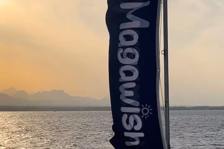 Magawish Island flag at sunset over the Red Sea, scenic moment on a private speedboat tour from Hurghada