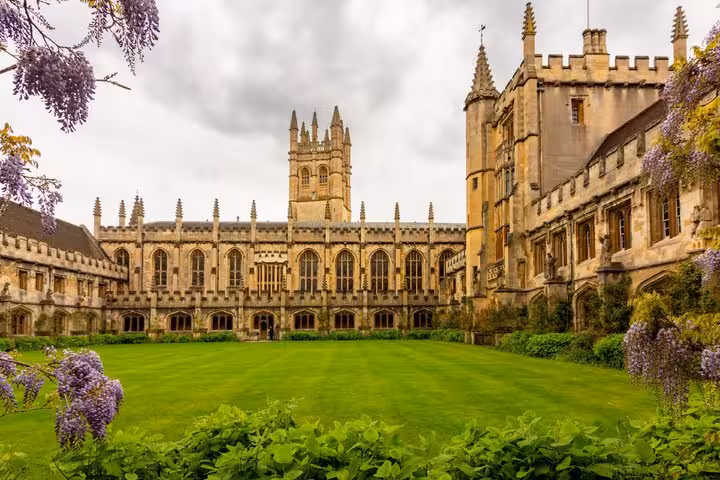 Magdalen College cloisters and tower with wisteria blooms on Oxford walking tour