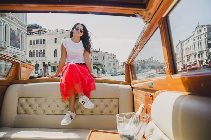 Relax on a luxurious mahogany boat with stunning views of Venice's Grand Canal during the full day experience.
