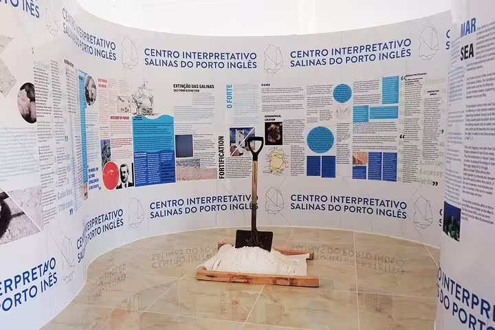 Exhibit at Centro Interpretativo Salinas do Porto Inglês, featuring educational panels about salt production on Maio Island.