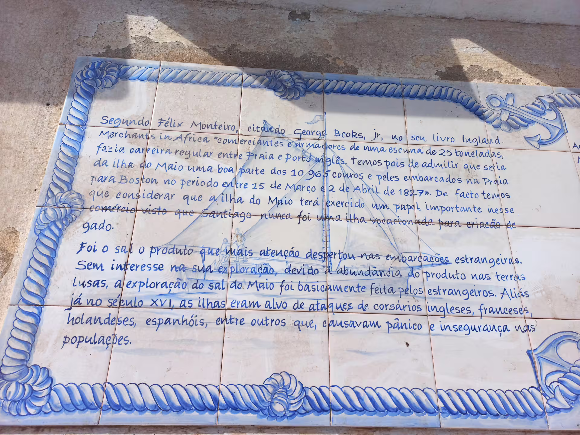 Historic ceramic tile display with text about Maio Island's salt trade history on a guided tour.