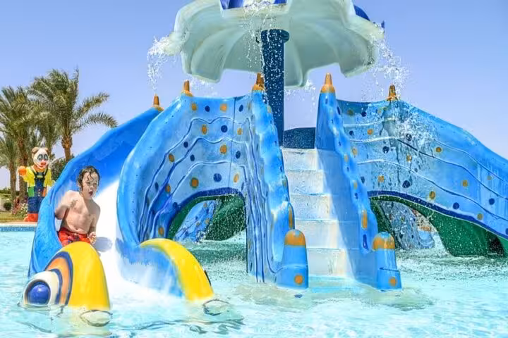 Kids splash at Makadi Water World water playground in Hurghada, waterpark tour with lunch and transfers