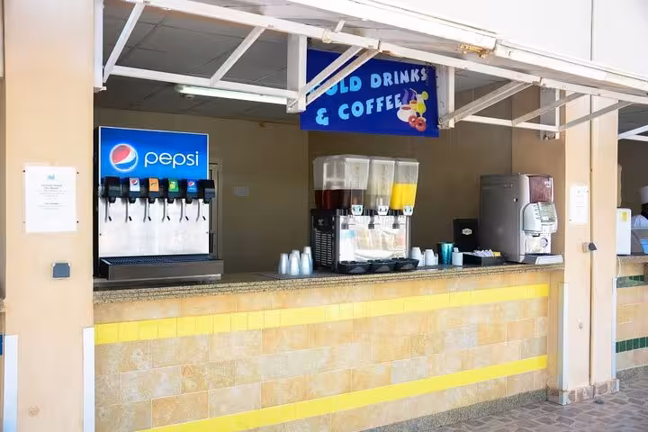 Makadi Water World snack bar with cold drinks and coffee station on Hurghada day trip with transfers