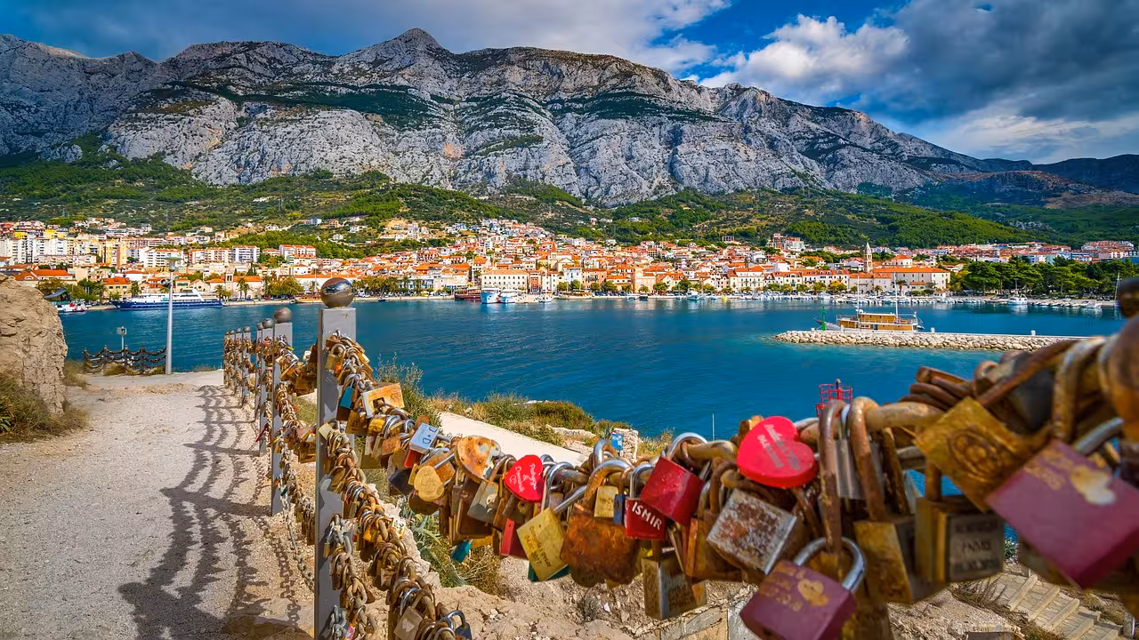 Makarska Riviera viewpoint with love locks, Adriatic harbor and Biokovo cliffs on Split day trip adventure