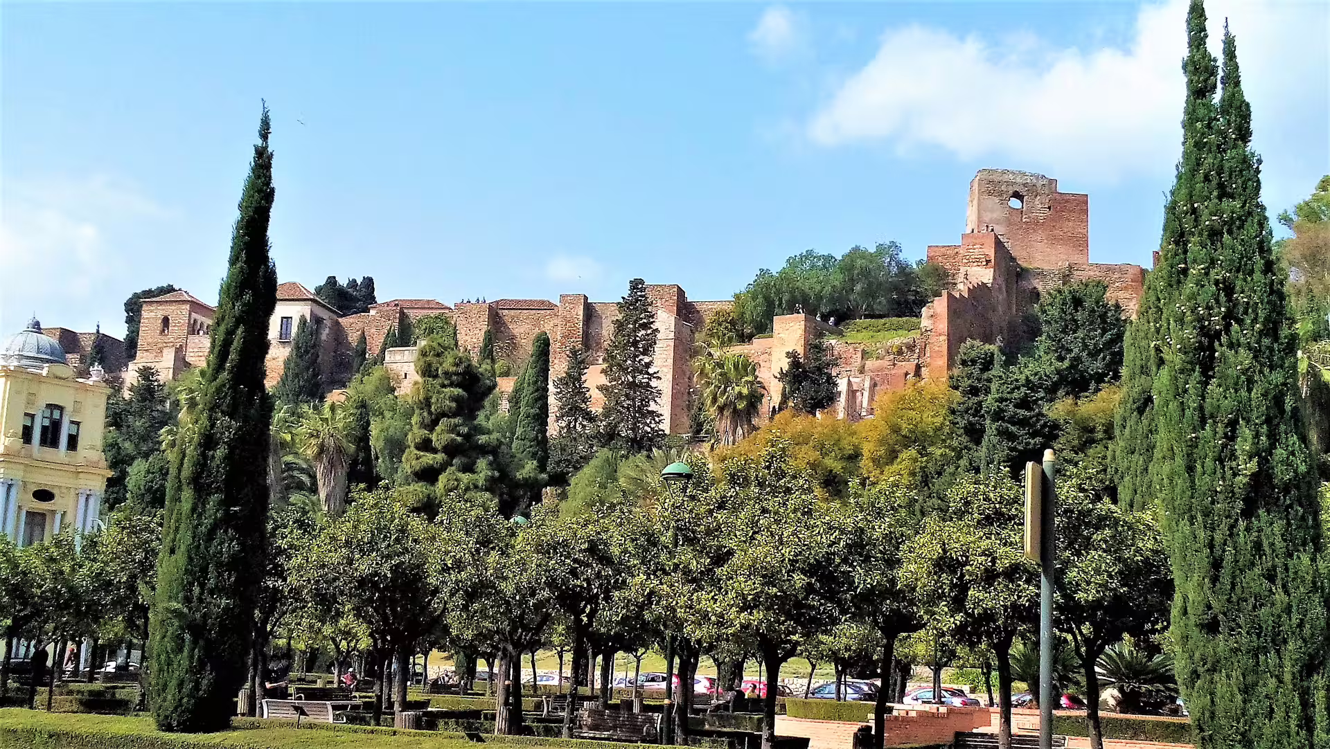 View of Malaga Alcazaba fortress from the park, featured on a private Malaga and Mijas full-day trip with pick-up