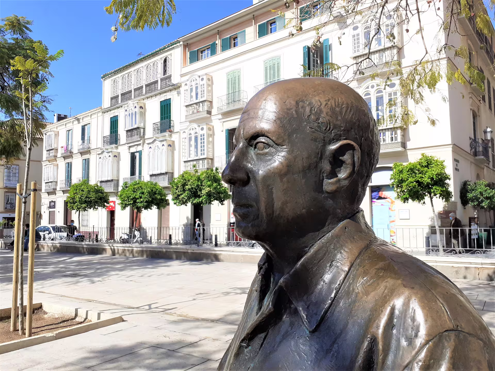 Bronze statue in Malaga old town plaza, a highlight on a guided group walking tour through the historic center