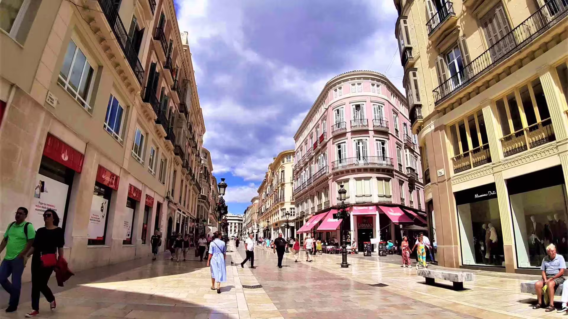 Pedestrian street in Malaga old town with historic buildings, perfect stop on private Malaga and Mijas day trip