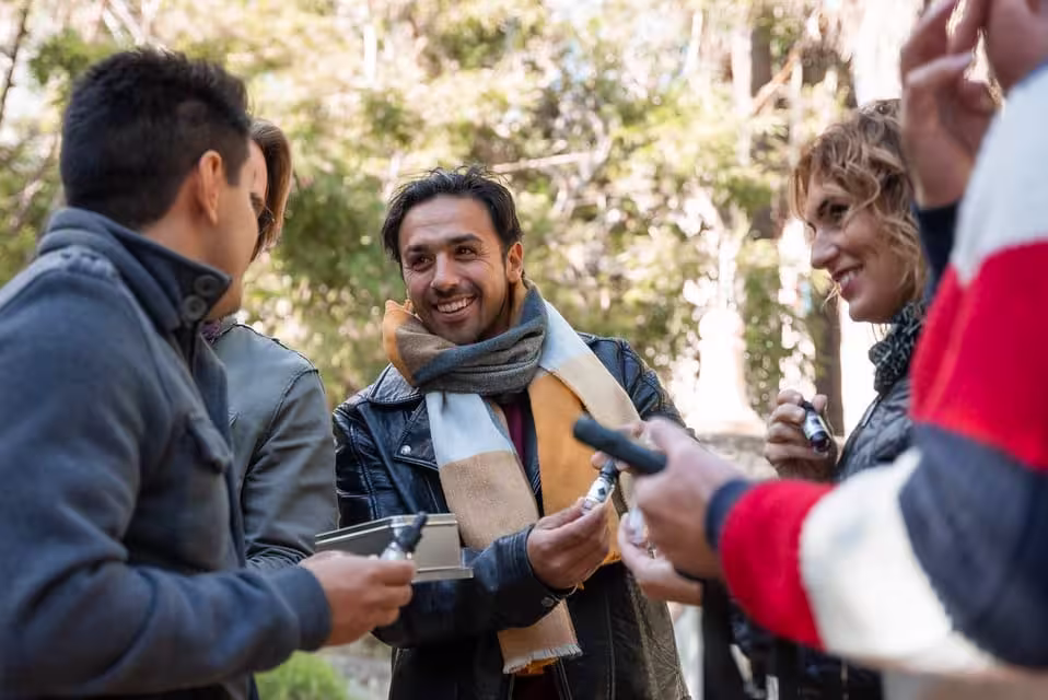 Participants collaborating and smiling during the Malaga Operation Mindfall outdoor escape game.