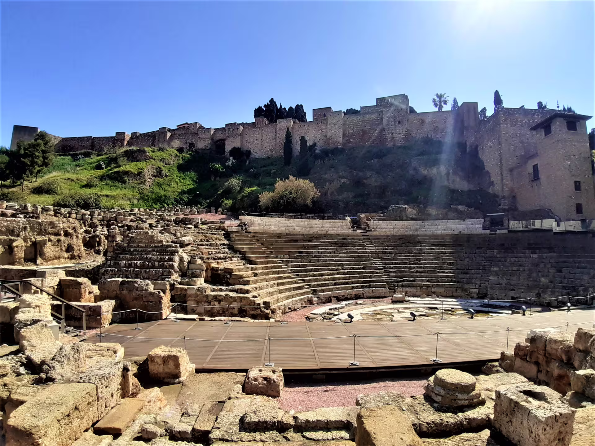 Roman Theatre of Malaga with Alcazaba fortress above, a highlight on private full-day tour with hotel pick-up