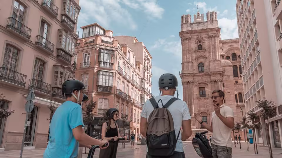 Segway tour participants exploring Malaga's historic architecture near the iconic cathedral.