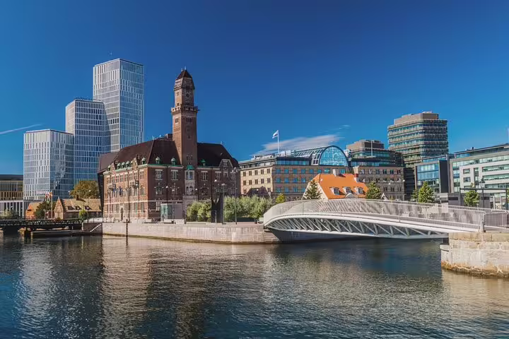 Scenic view of Malmö's historic and modern architecture by the canal, featured in a full-day train trip from Copenhagen.