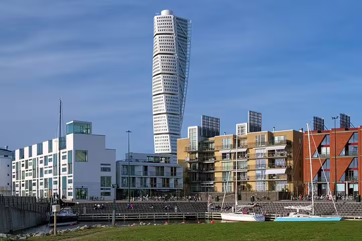 View of Malmö's iconic Turning Torso and waterfront buildings during a private full-day train trip from Copenhagen.