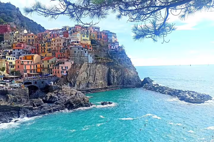 Panoramic view of Manarola village perched on cliffs above the Ligurian Sea on a private Cinque Terre day trip