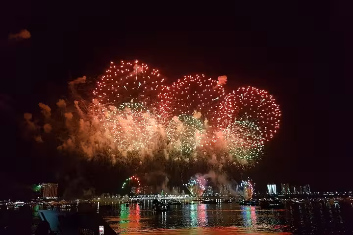 New Year’s Eve fireworks over Manaus waterfront seen from a boat cruise on the Rio Negro, Amazon Brazil